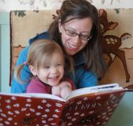 Woman reading to young girl