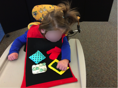 Child wearing tactile vest