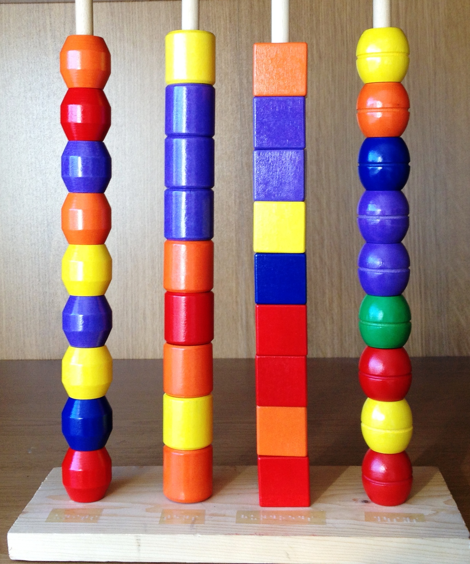 homemade abacus using blocks and dowels