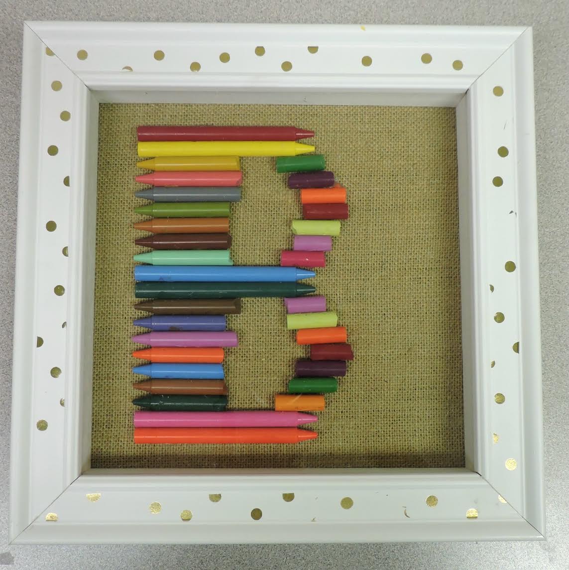 Crayons forming the letter "B"