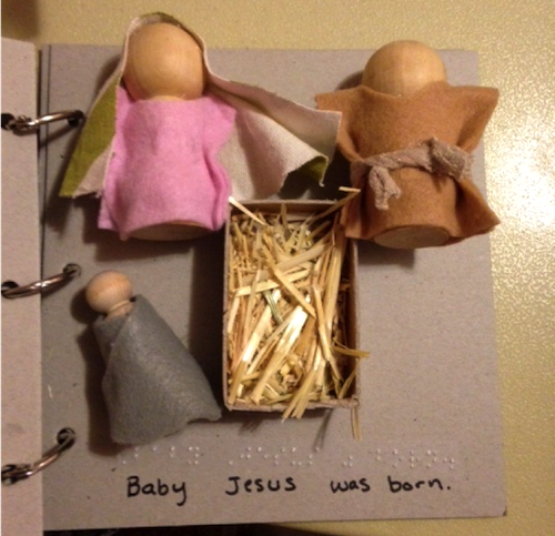 Jesus, Mary, and Joseph in manger on tactile page