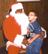 Child sits on Santas lap