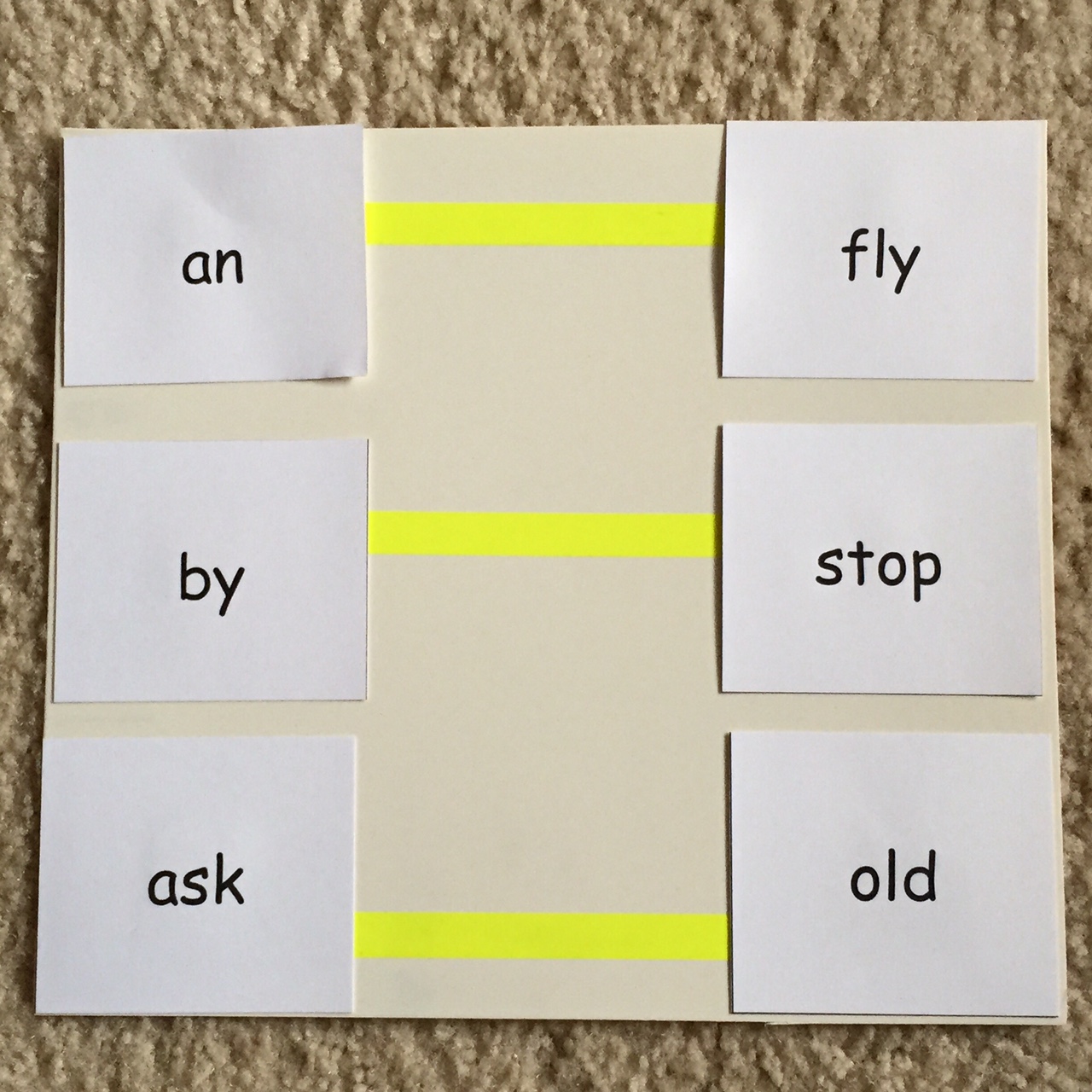 monocular words on paper with yellow tape