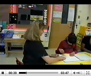 Still from video of Robbie Blaha and student