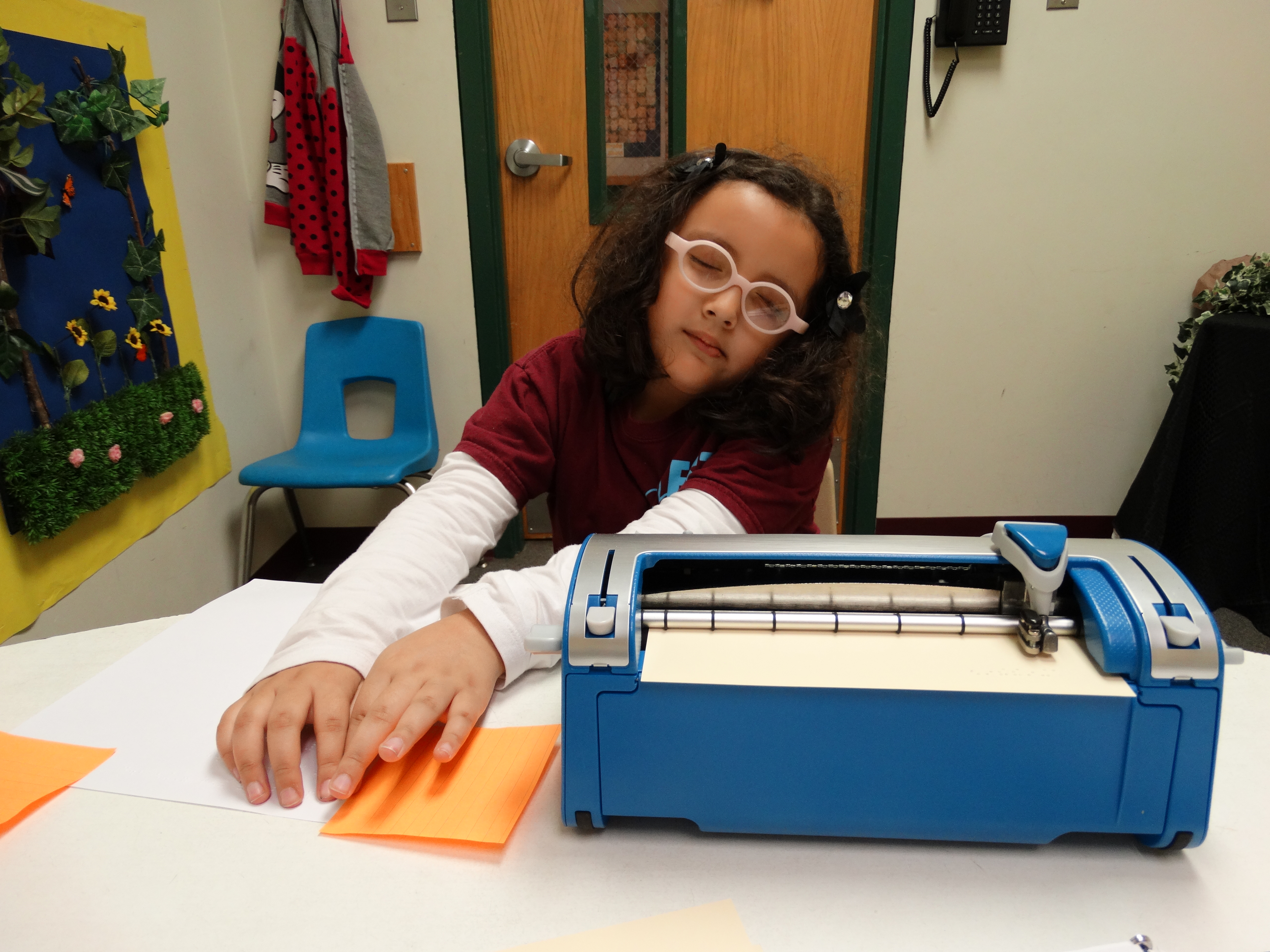 student using braillewriter