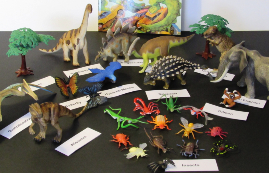 assorted dinosaur toys