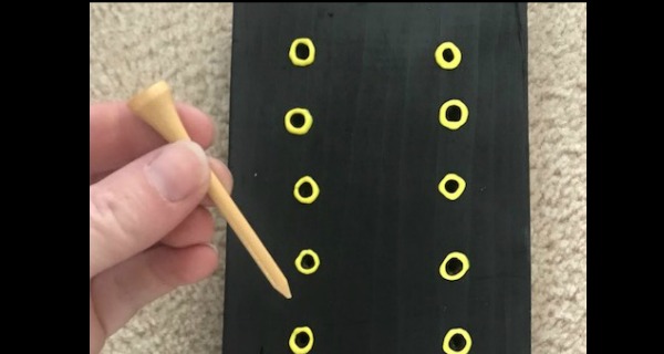 Tactile incentive chart with golf tee