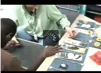Screenshot of a student who is deafblind examining his object calendar.
