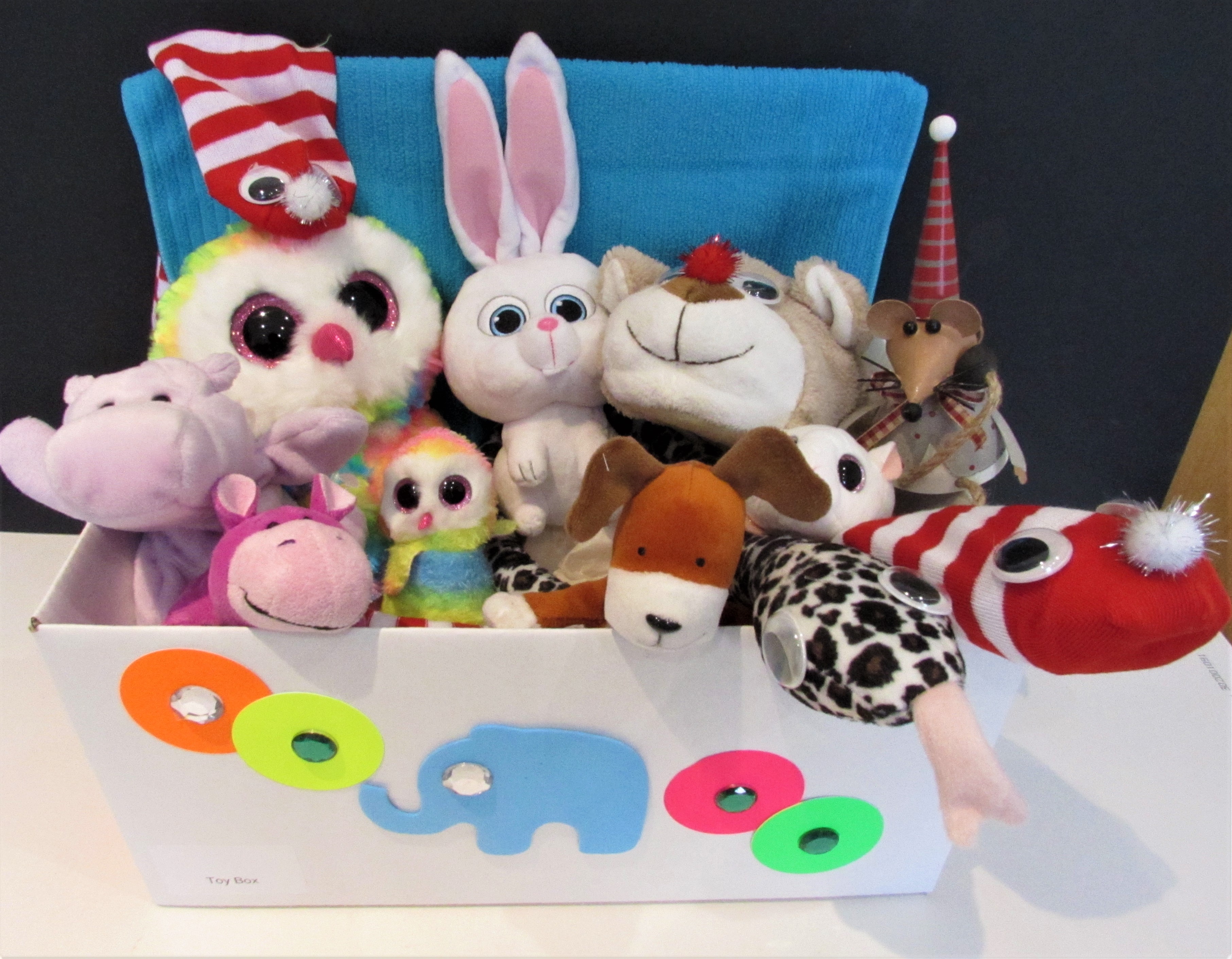 stuffed toys in a small toy box