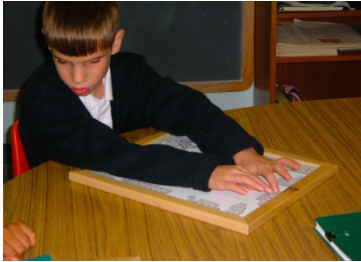 Child Using Math Window Braille 