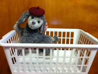 stuffed animal in a small basket
