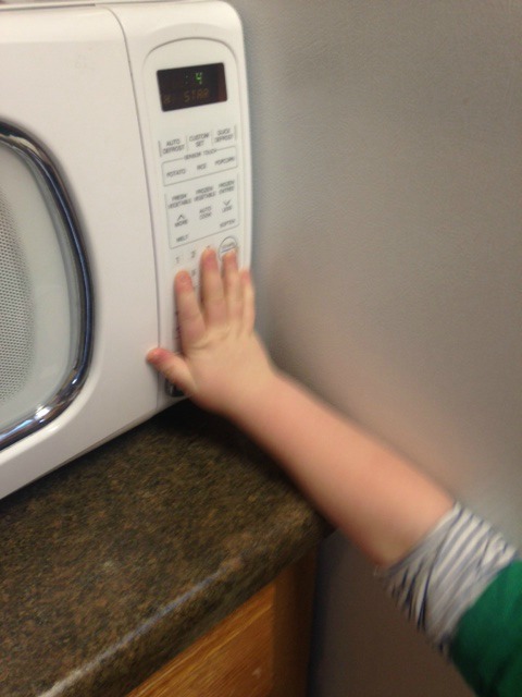 liam reading braille on microwave