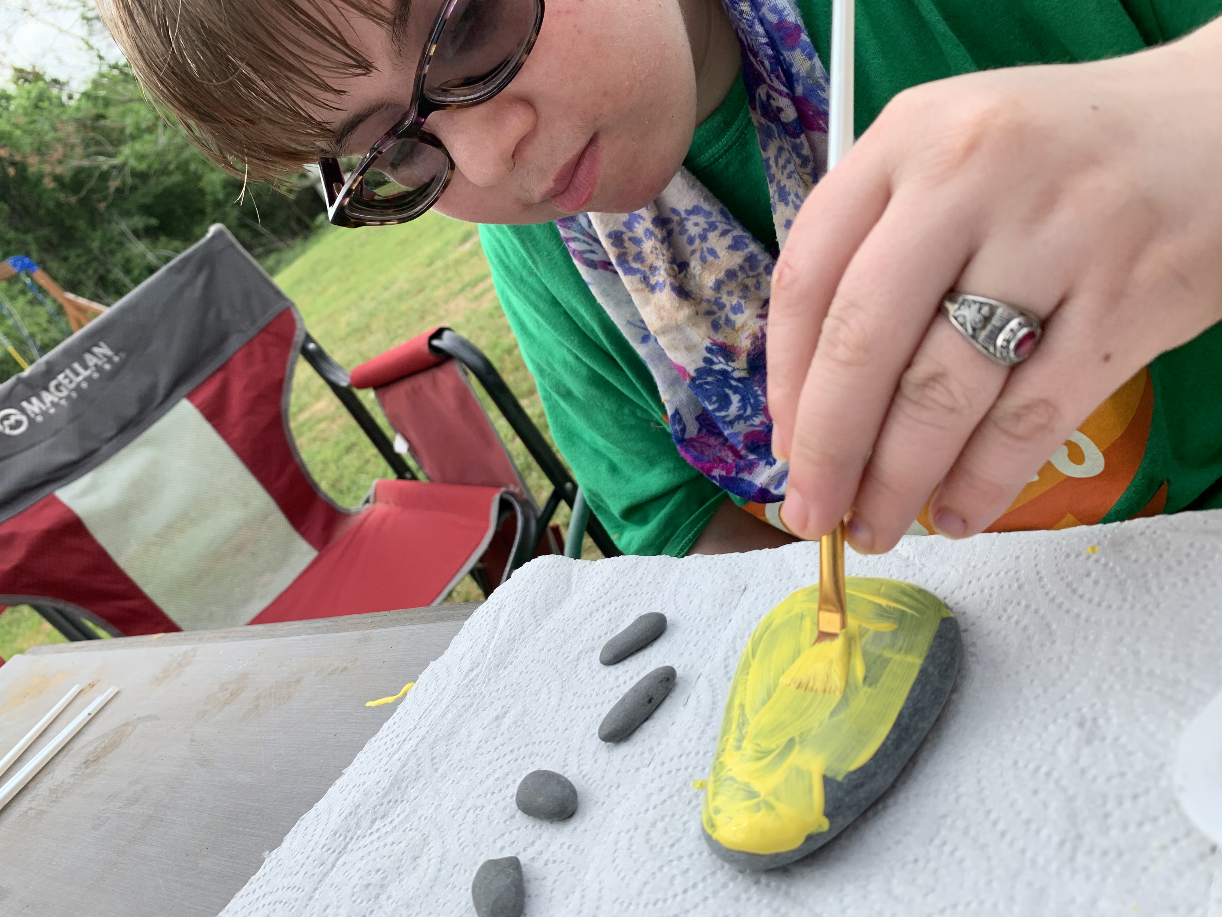Student painting rock