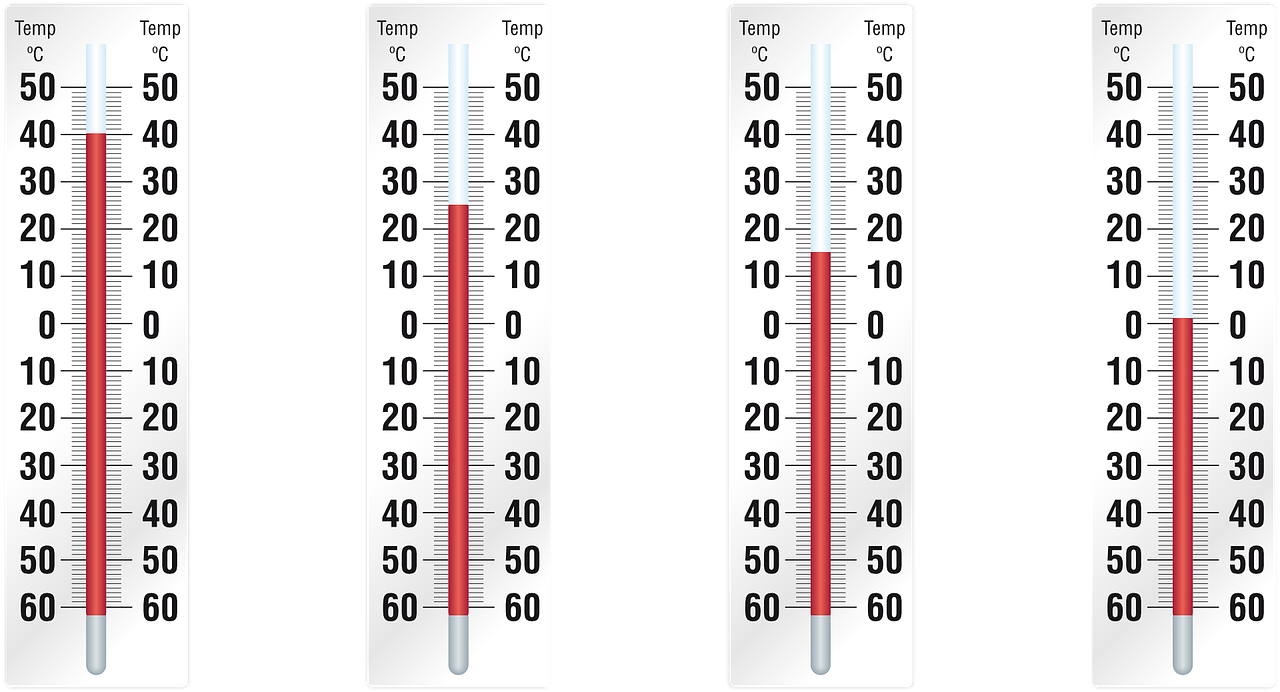 four thermometers displaying different temperatures