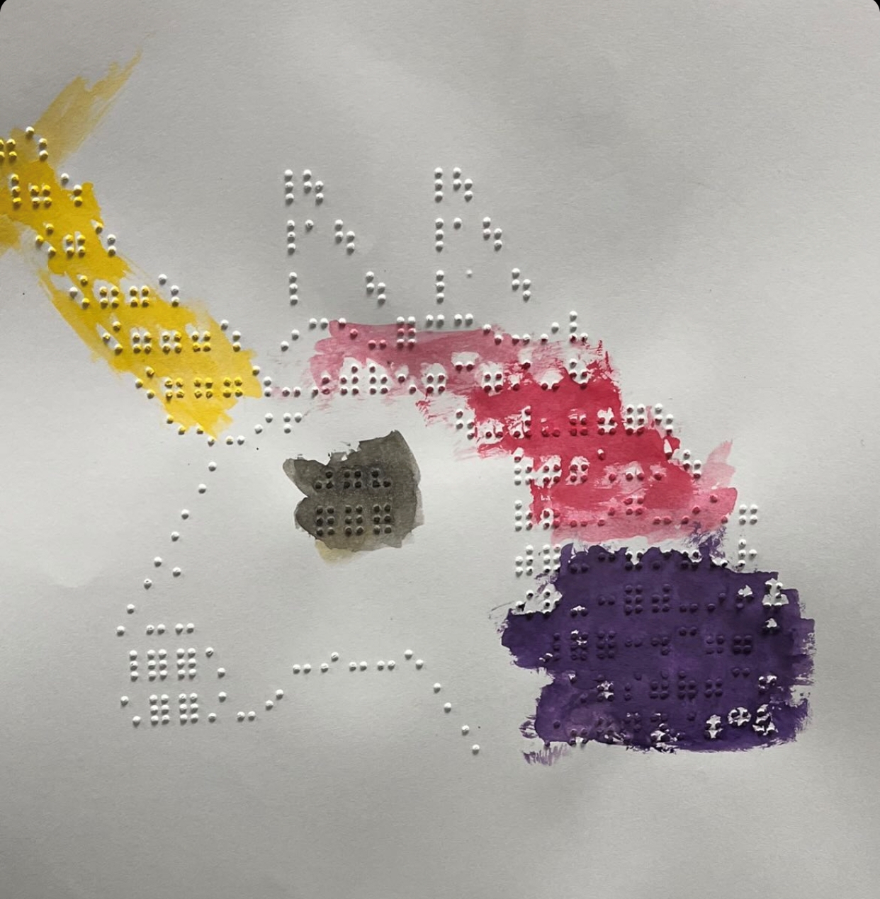 Unicorn braille design with watercolors painted on it