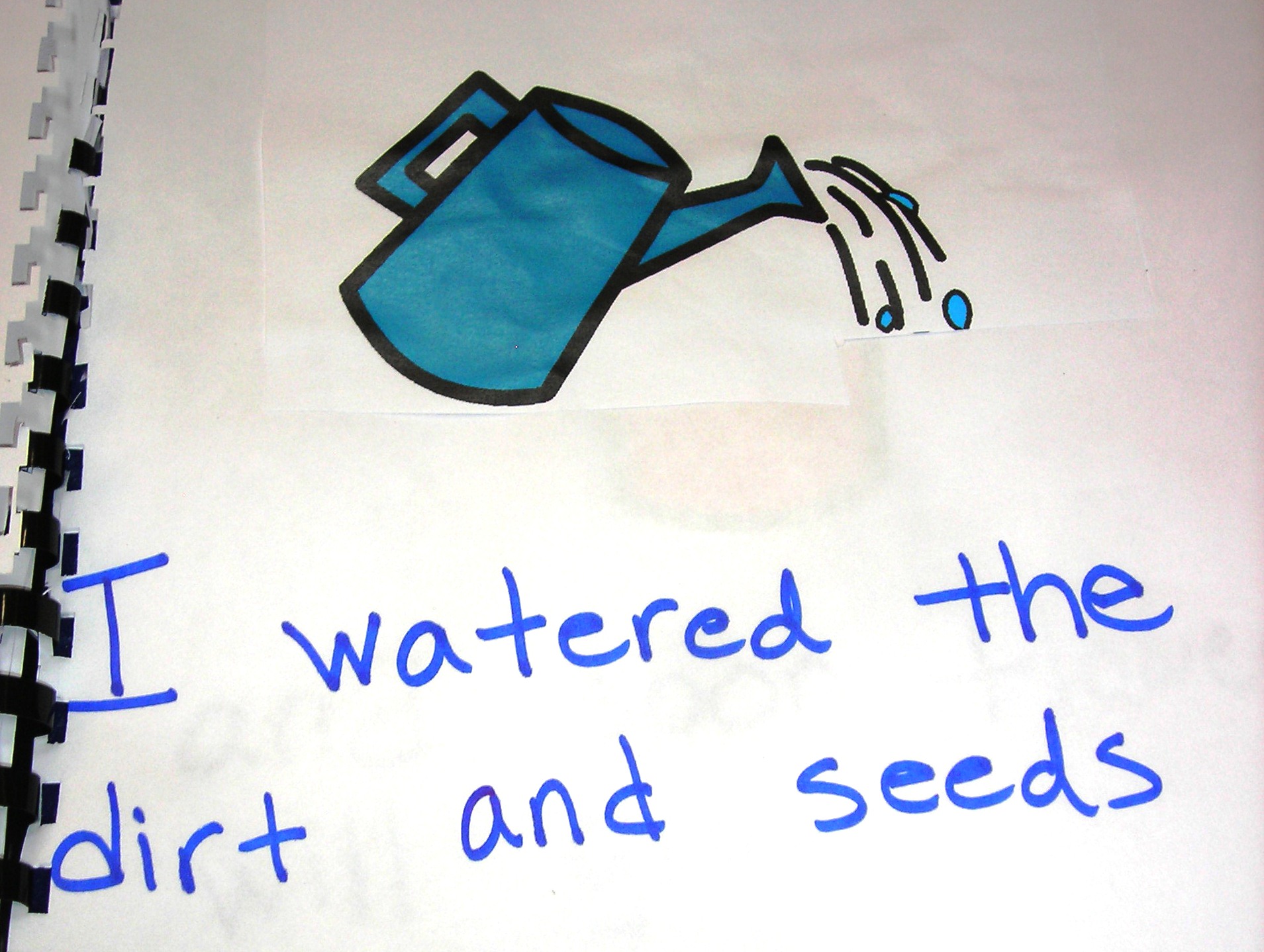 Page of language experience story about watering the plant